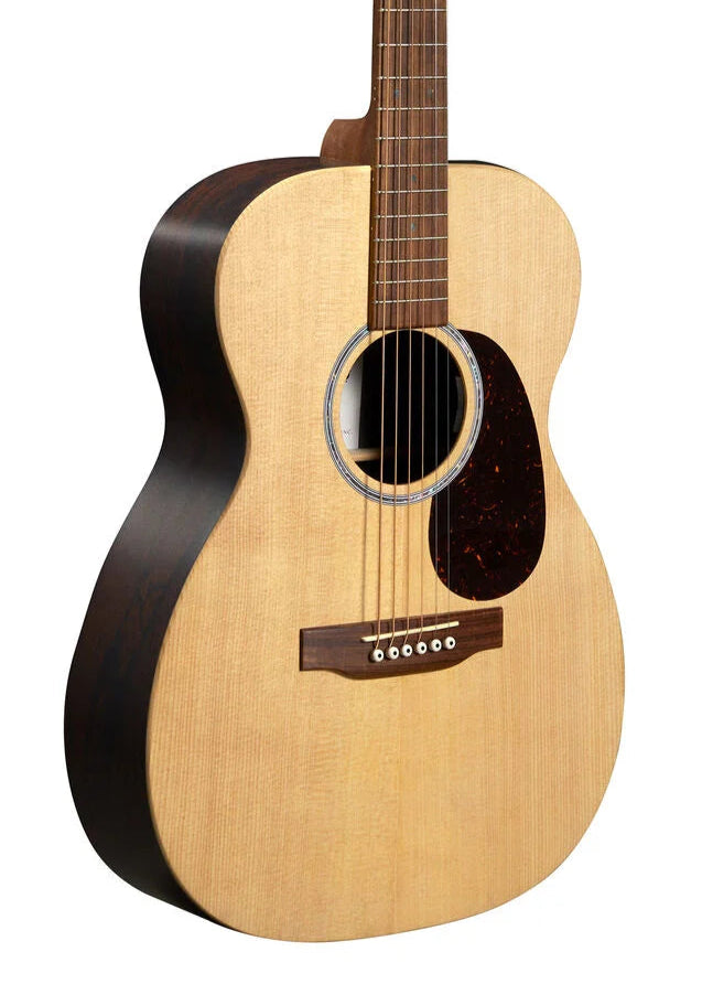 Acoustic guitar with a light wood top, dark sides, round sound hole, six strings, and a tortoiseshell-colored pickguard below the strings.