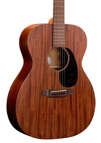 Brown acoustic guitar with a dark wood grain finish, black pickguard, six strings, and a rounded body shape.