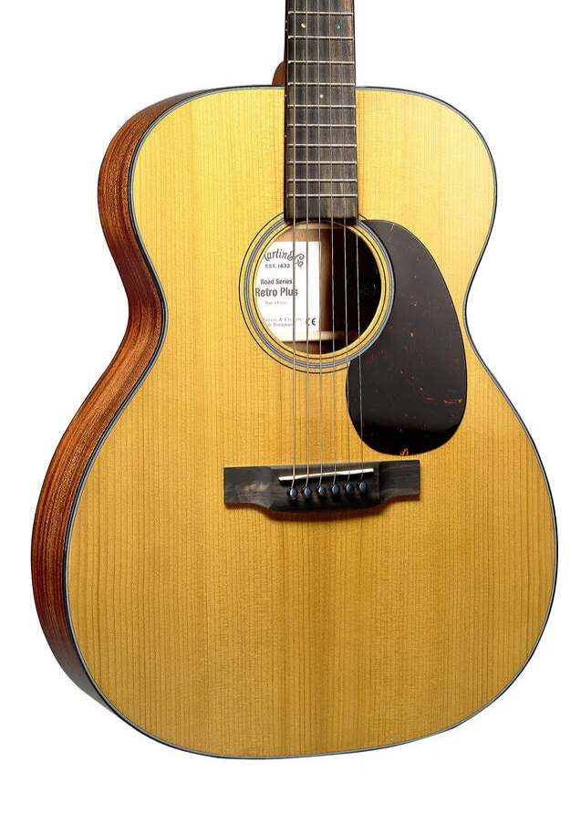 Light wood acoustic guitar with a dark pickguard, six strings, and a round sound hole; sides have a reddish-brown wood grain finish.