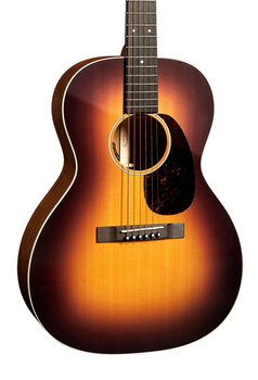 Acoustic guitar with a sunburst finish, six strings, dark edges, light center, round sound hole, and a tortoiseshell-style pickguard.