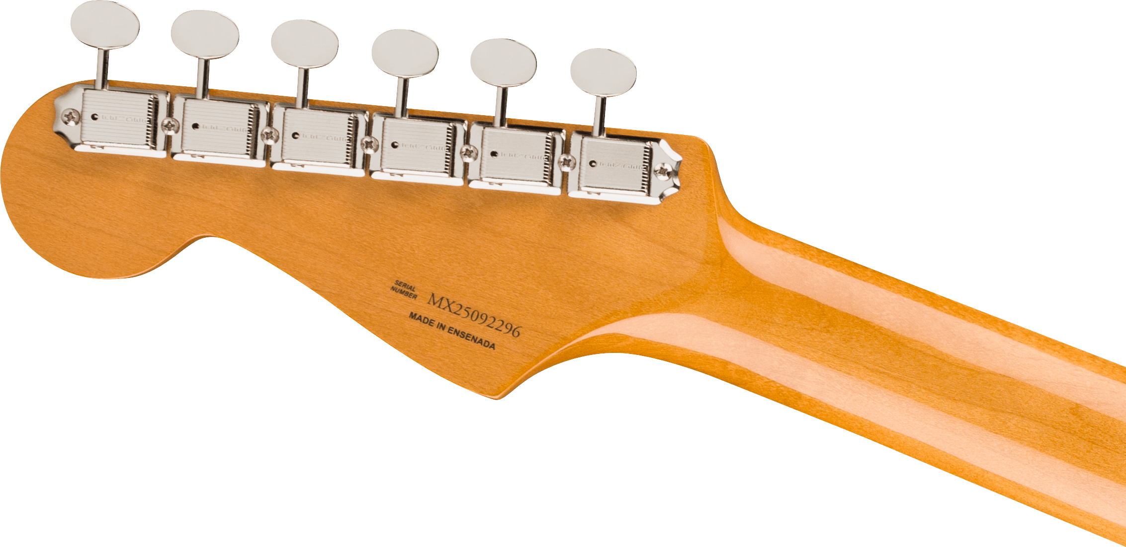 Tête de guitare électrique en bois clair, six mécaniques argentées alignées, numéro de série et mention “Made in Ensenada” gravés.