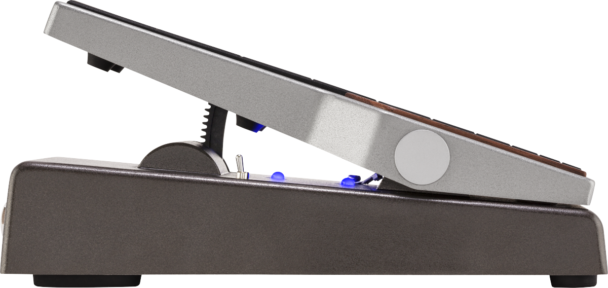 Silver FX pedal with a slanted treadle, brown grip strips, round side knob, blue indicator lights, and gear teeth mechanism on the side.