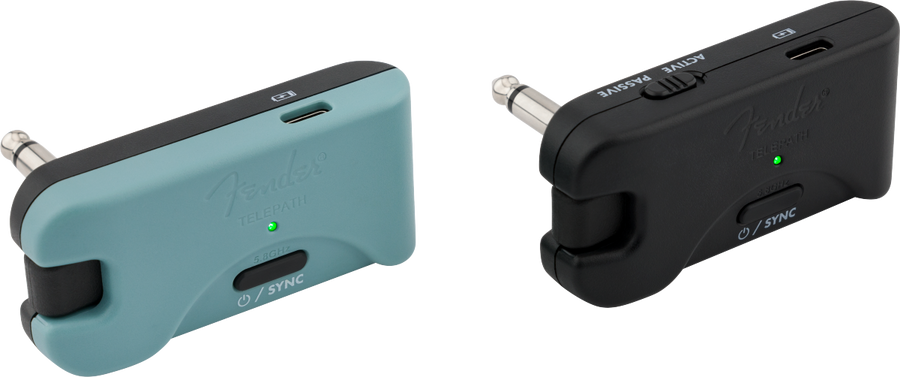Two Fender Telepath wireless audio transmitters, one teal and one black, each with a jack plug, USB-C port, sync button, and indicator light.