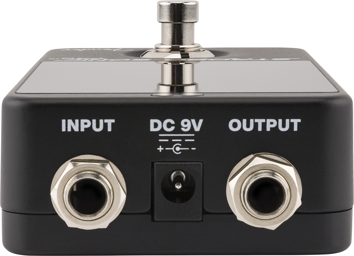 Black FX pedal showing input and output jacks, a DC 9V power socket in the center, and a metal footswitch on top.