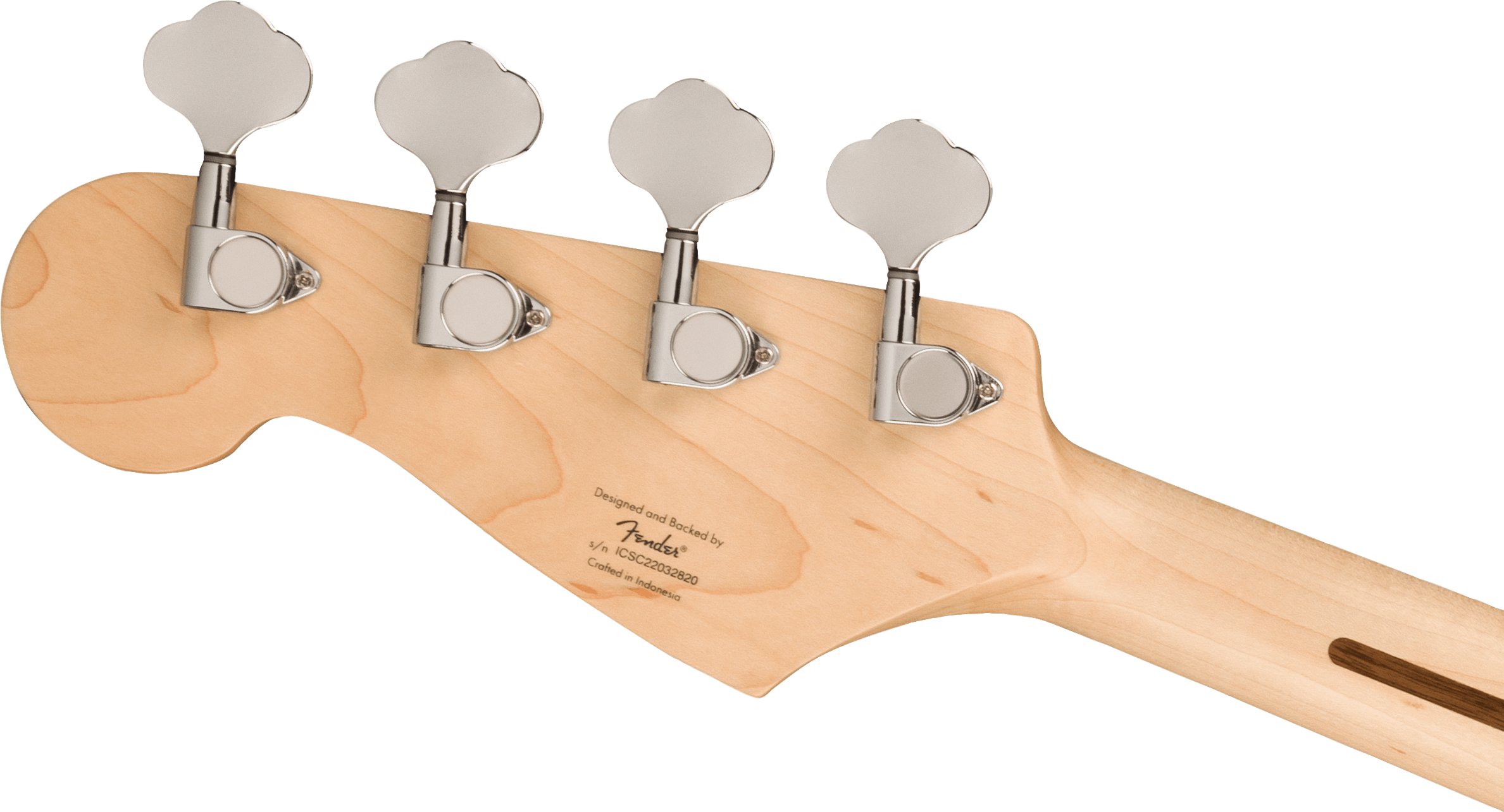 The back of a Squier bass guitar headstock in natural wood shows four chrome tuning pegs and a small inscription near the base.