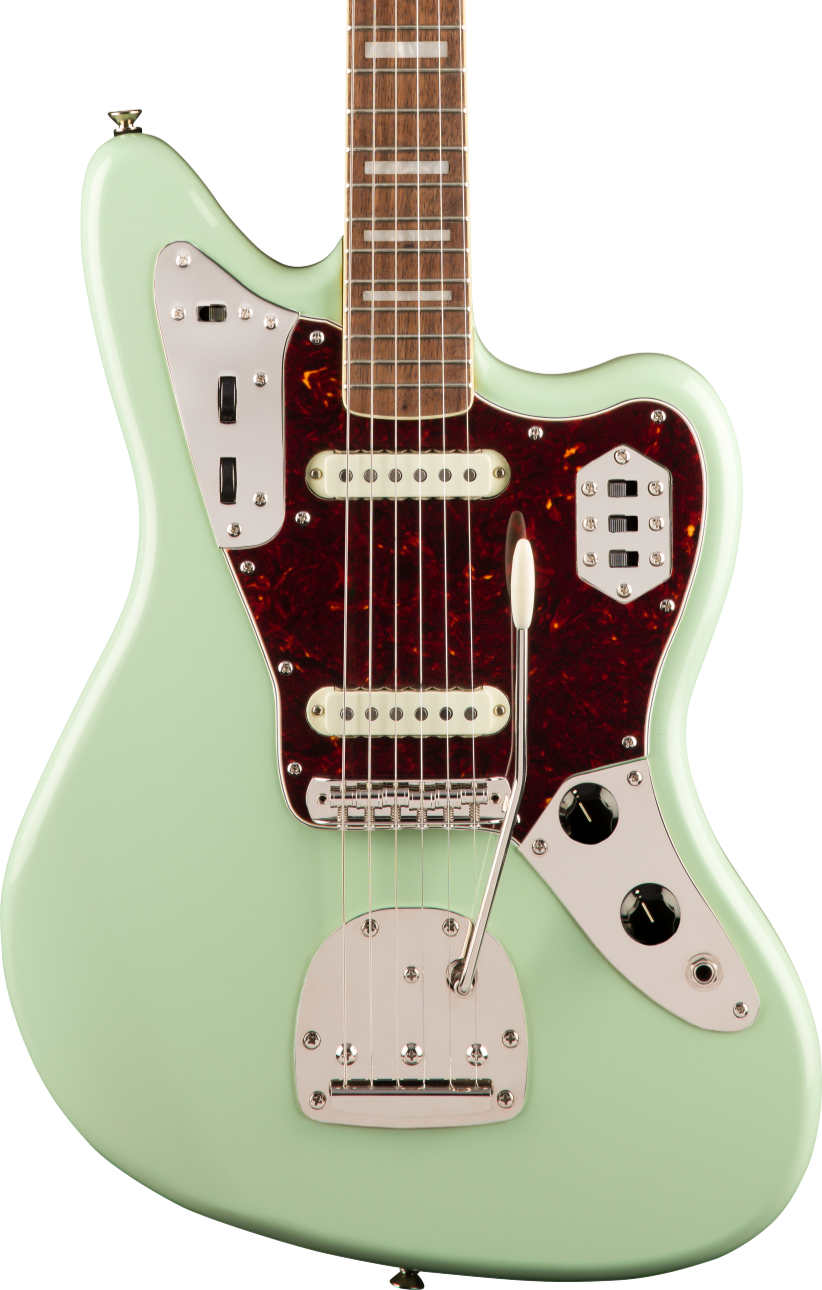 Seafoam green electric guitar with two white pickups, chrome hardware, tortoiseshell pickguard, multiple switches, and a tremolo arm.