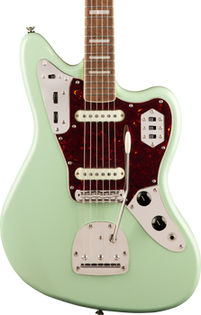 Seafoam green electric guitar with two white pickups, chrome hardware, tortoiseshell pickguard, multiple switches, and a tremolo arm.
