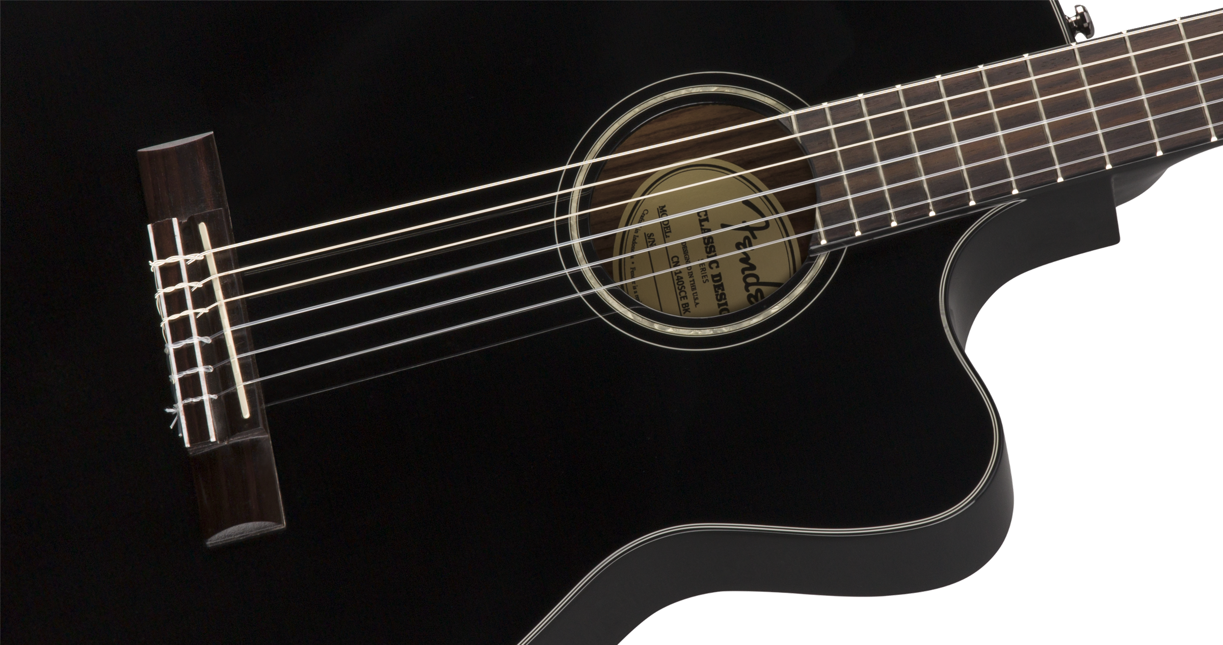 Glossy black classical guitar with six nylon strings, a circular sound hole, and a curved cutaway body for easier access to higher frets.