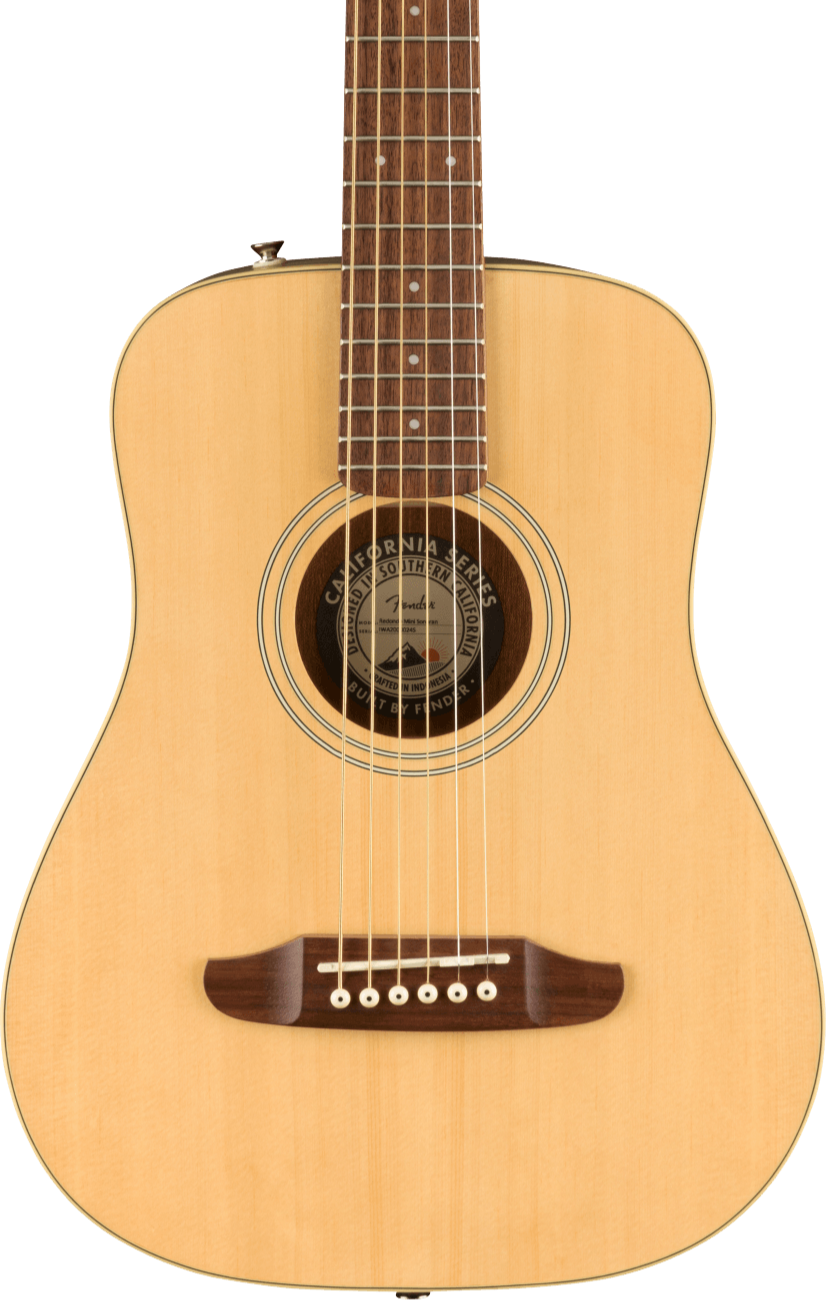 Small acoustic guitar with a natural wood finish, six steel strings, a dark wood bridge, and a round sound hole with a California Series label inside.