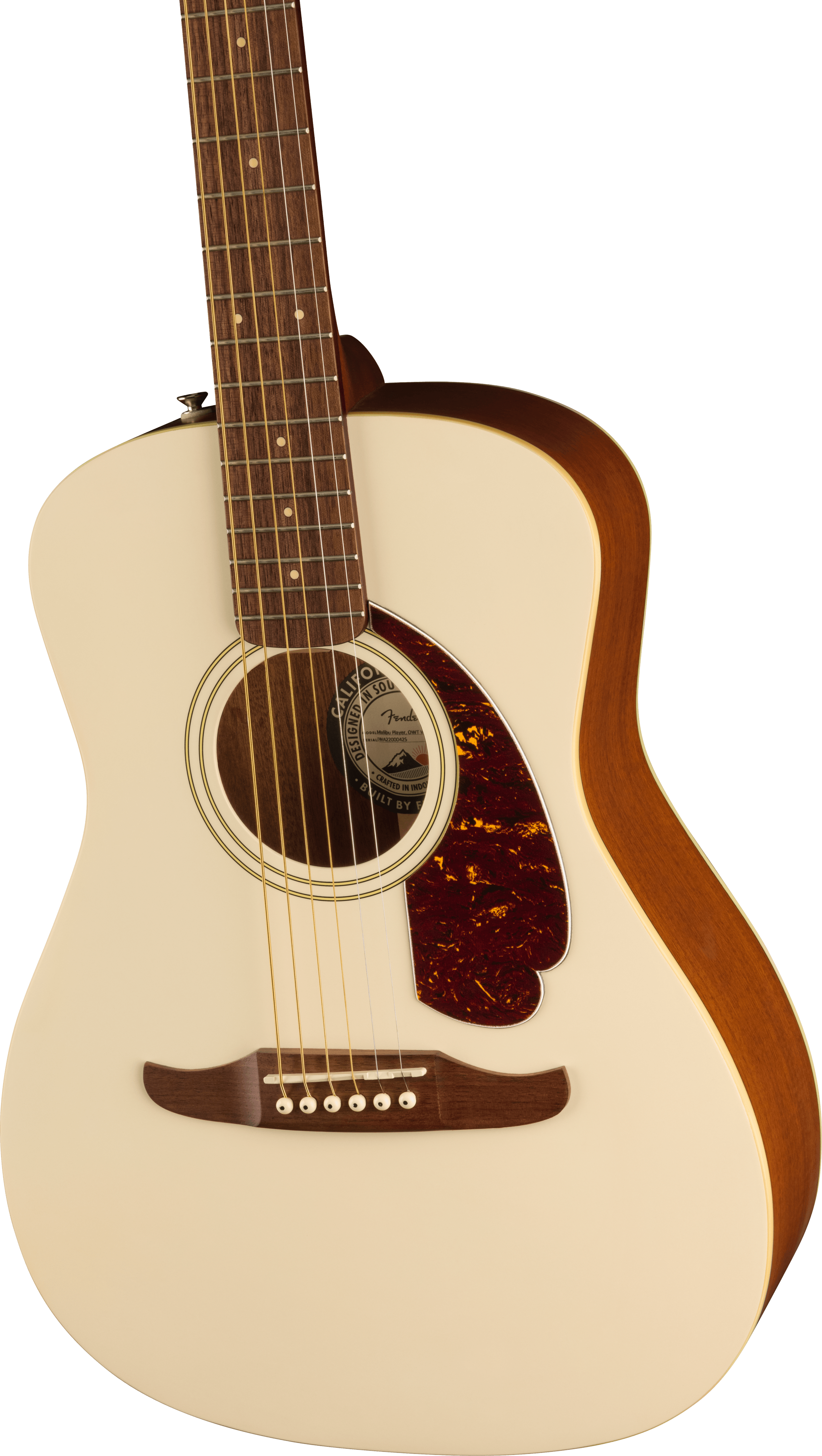 Cream-colored acoustic guitar with a reddish-brown pickguard, wooden bridge, and light brown sides and neck. Six strings, round soundhole.