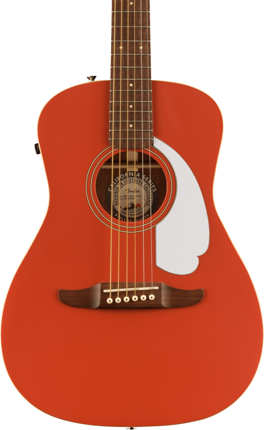 Bright reddish-orange acoustic guitar with a white, uniquely-shaped pickguard and six strings; circular sound hole shows the label inside.