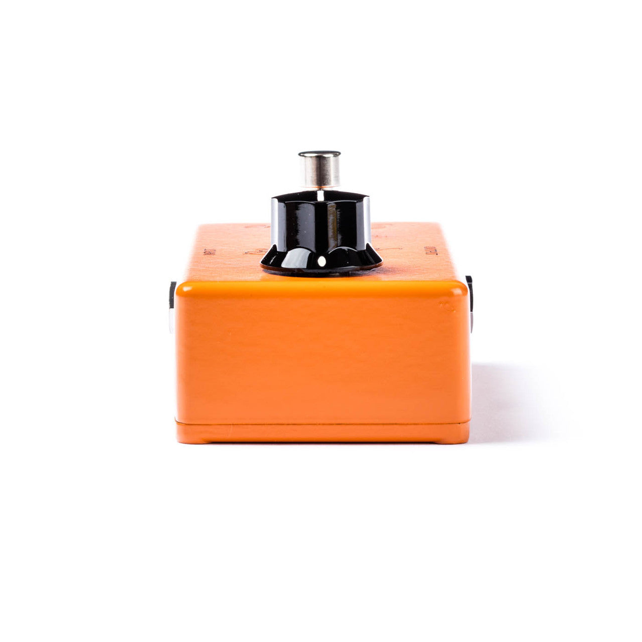 Orange FX pedal viewed from the front, featuring a single large black knob on top and a metal switch or footswitch above the knob.
