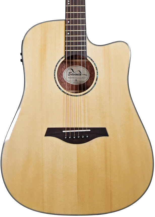 Light wood acoustic guitar with a cutaway body, six strings, dark wood bridge, and circular sound hole with decorative ring.