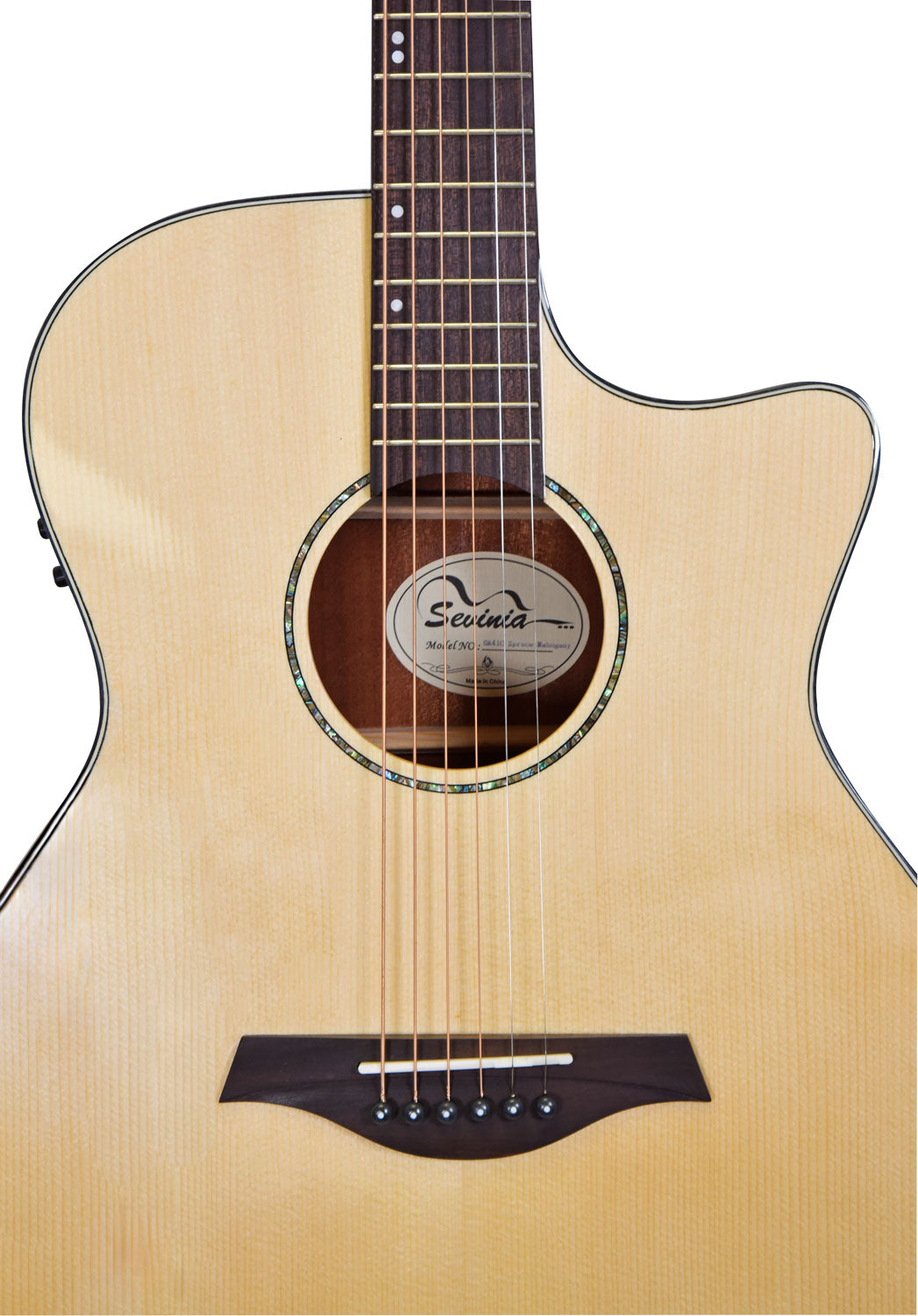 Light wood acoustic guitar, cutaway body, six strings, round sound hole with abalone trim, dark wood bridge, and visible brand label inside.