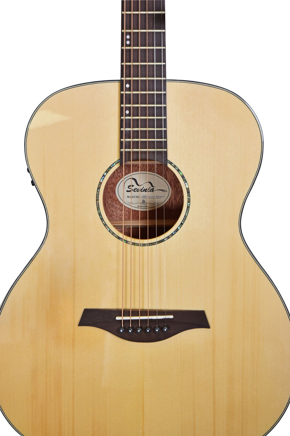 Light wood acoustic guitar body with a dark wooden bridge, six strings, circular soundhole, and abalone-style inlay around the soundhole.