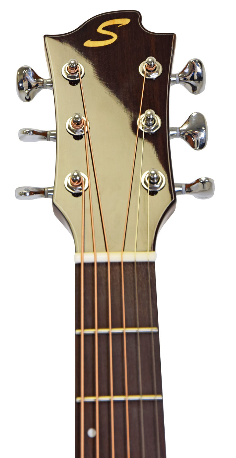 Six-string acoustic guitar headstock with chrome tuning pegs, gold "S" logo on dark wood, and light-colored vertical inlay down the center.
