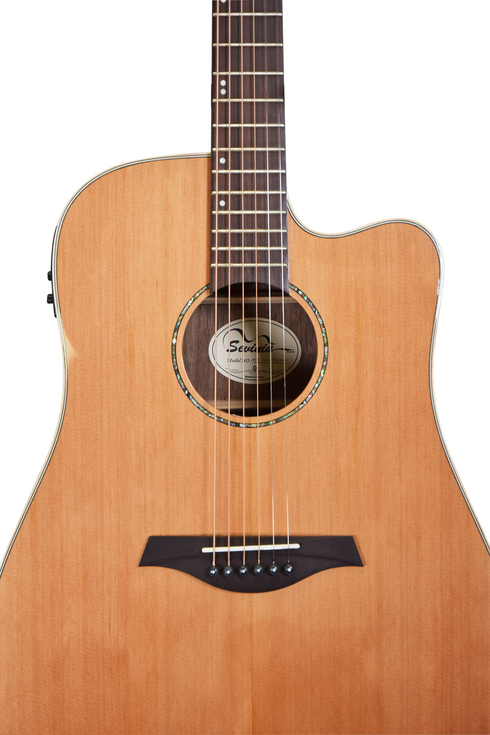 Natural wood acoustic guitar with six strings, a single cutaway, circular sound hole, and dark brown bridge with six pins.