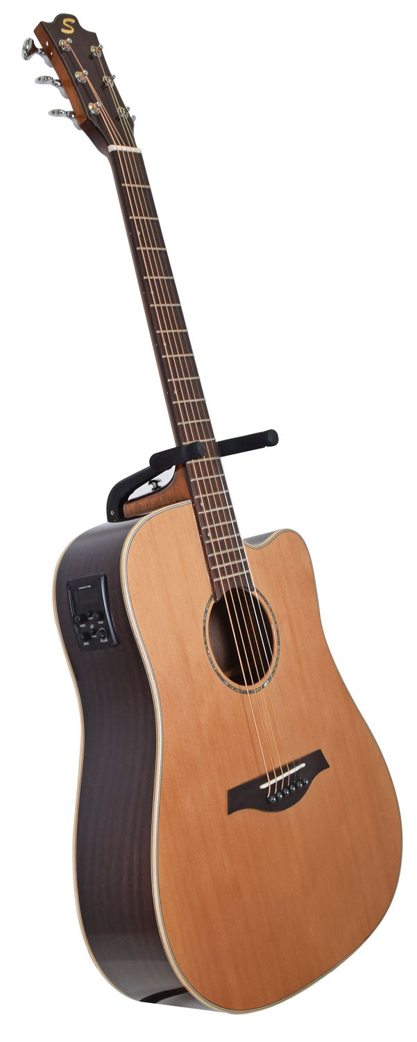 Natural wood acoustic guitar with a dark brown body, electronic controls on the side, and a black capo clipped on the neck.