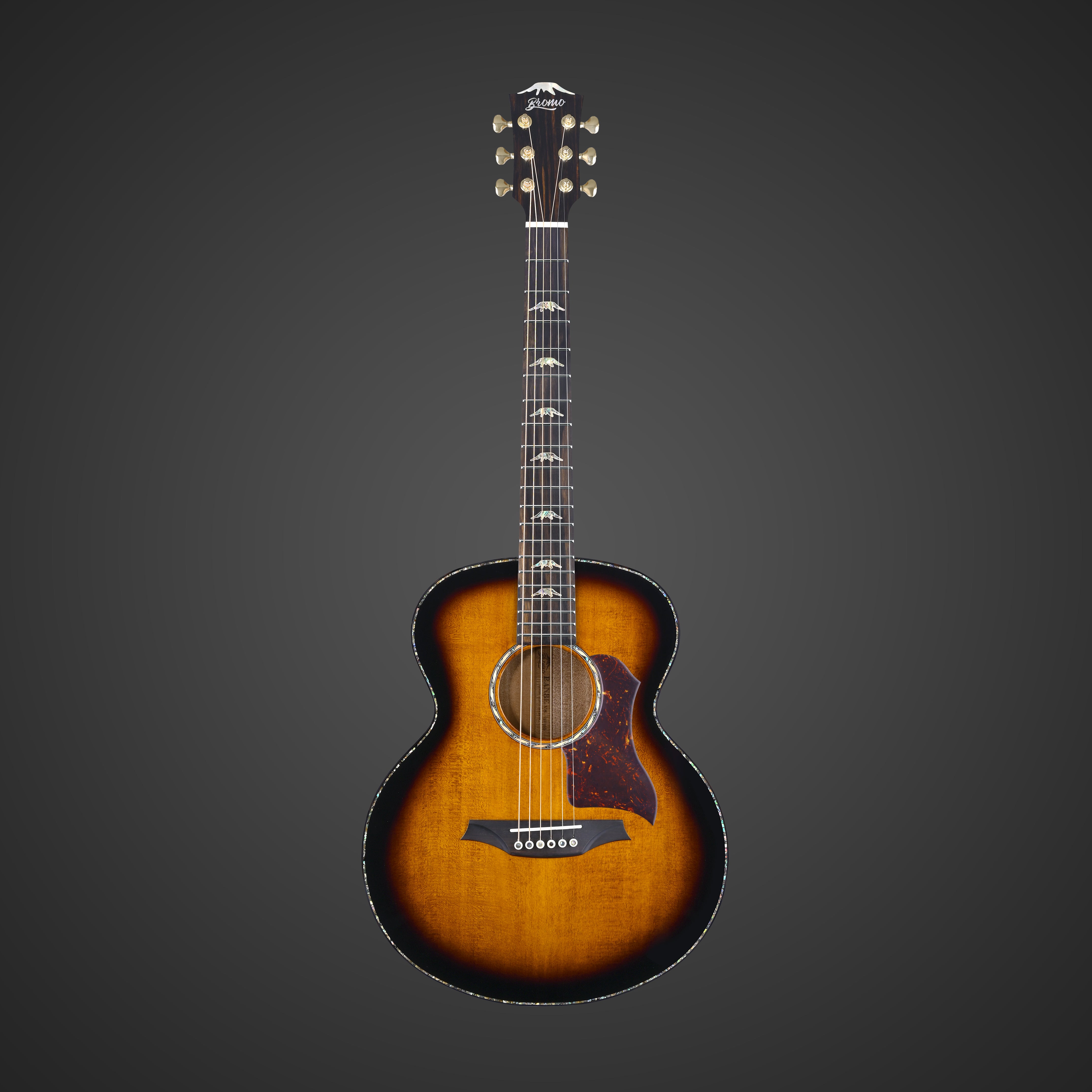 Sunburst finish acoustic guitar with a rounded body, dark edges, decorative pickguard, six strings, and detailed inlays on the fretboard.