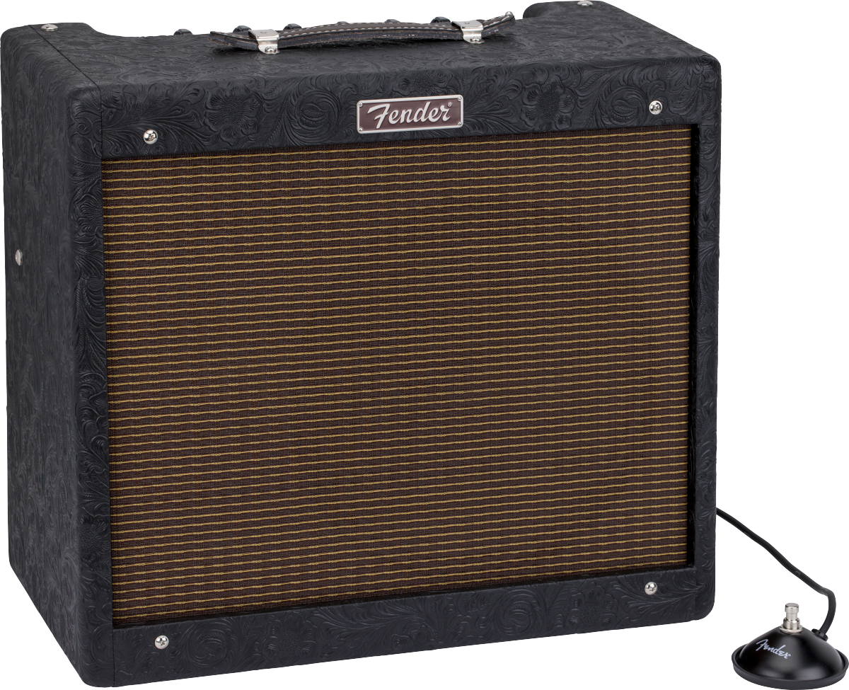 Fender amplifier with black floral-patterned casing, brown striped speaker grill, leather handle on top, and a round footswitch connected by cable.