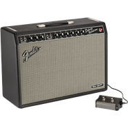 Fender amplifier with a black casing, silver grille, control knobs on top, and a connected footswitch placed to the right.
