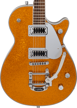 Electric guitar with a gold glitter body, two chrome humbucker pickups, silver pickguard, three control knobs, and a Bigsby tremolo arm.