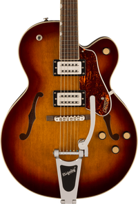 Sunburst-finish electric guitar with two humbucker pickups, Bigsby tremolo, tortoiseshell pickguard, four knobs, and two f-shaped sound holes.