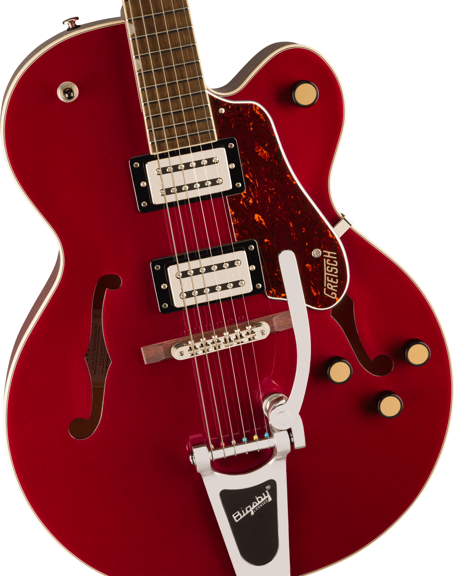 Red electric guitar with two humbucker pickups, Bigsby tremolo, four gold control knobs, and f-shaped sound holes on a semi-hollow body.