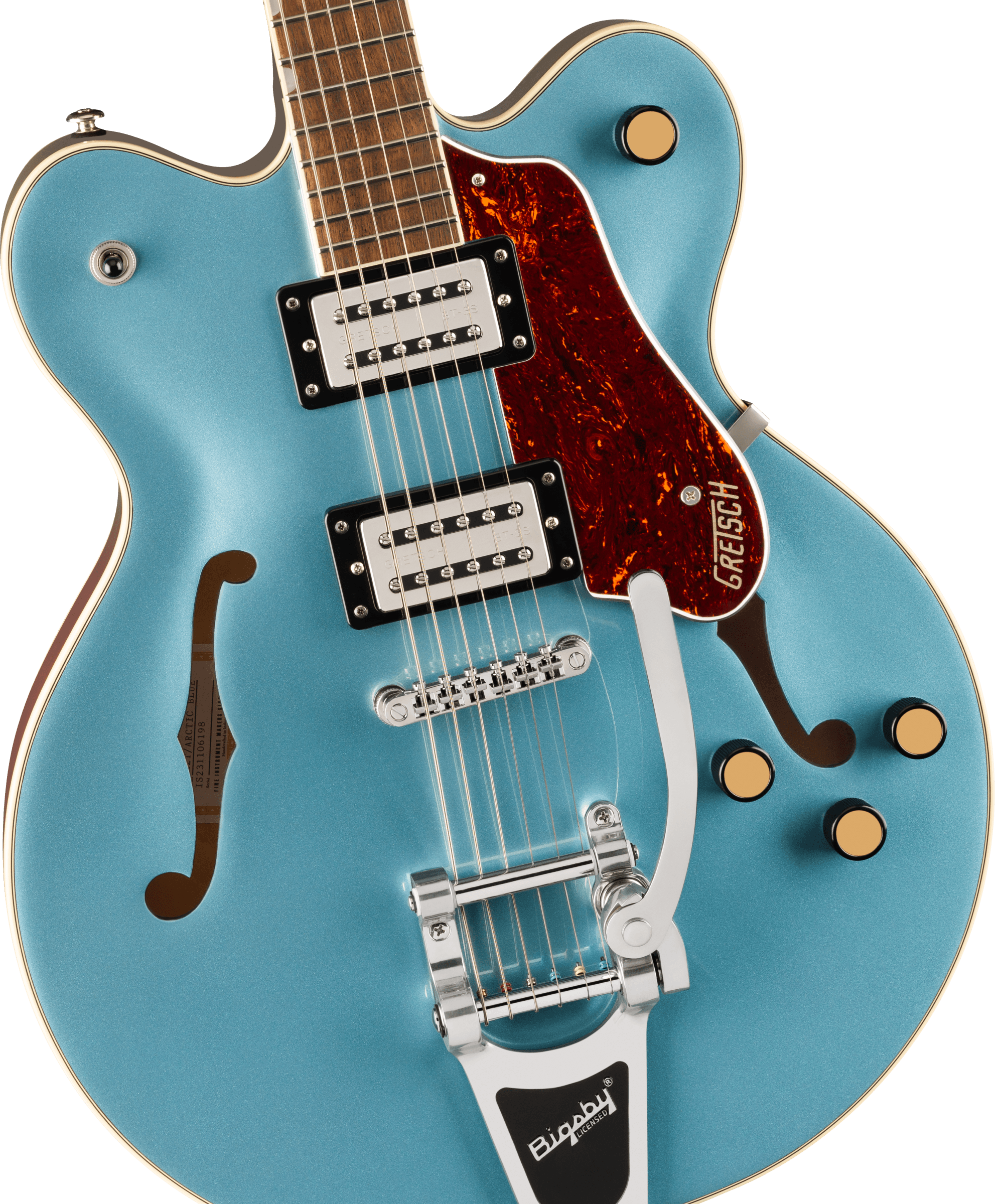 Metallic blue electric guitar with two pickups, brown pickguard, gold knobs, F-shaped sound holes, and a chrome Bigsby tremolo tailpiece.