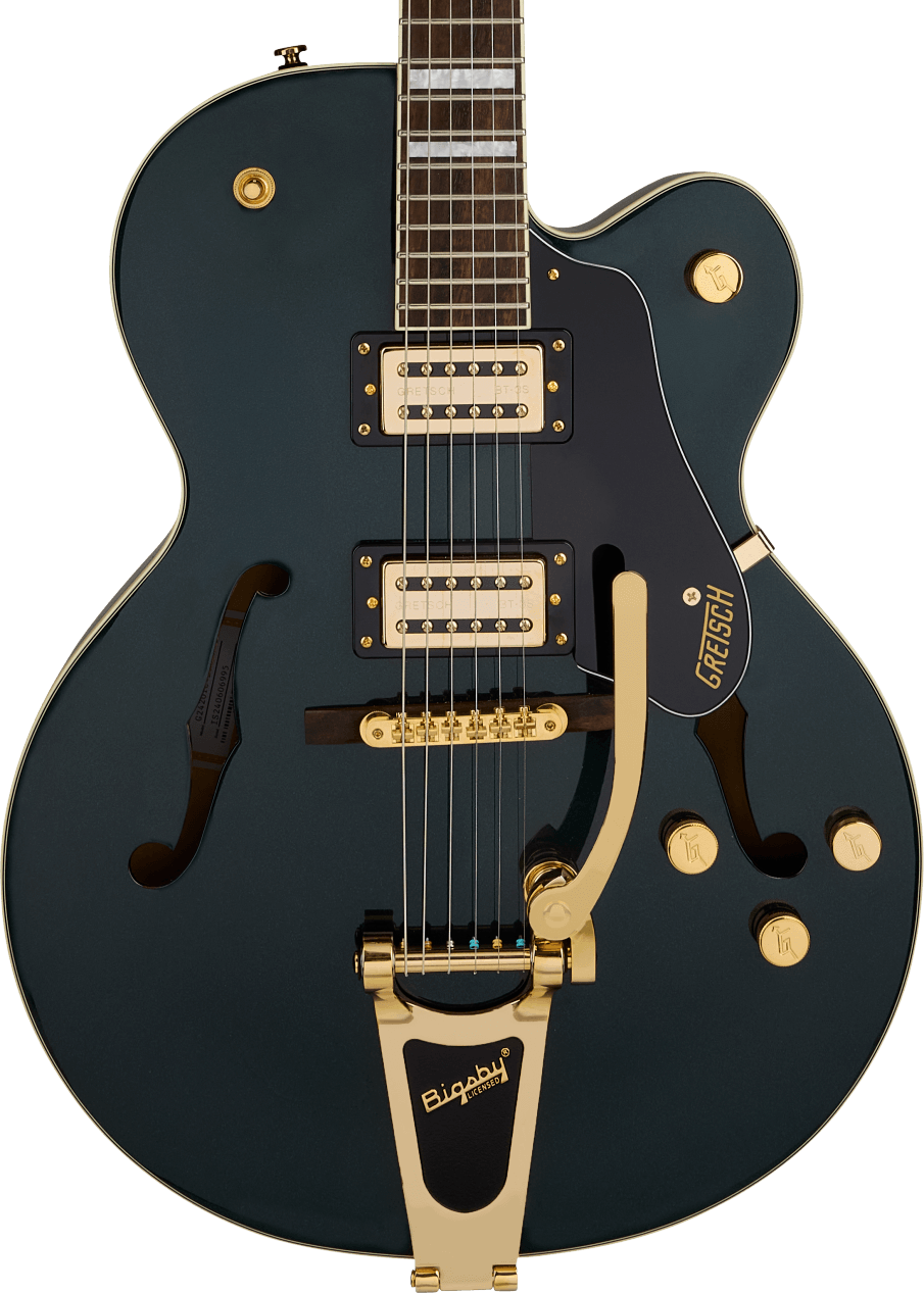 Hollow body electric guitar in dark green with gold hardware, two cream humbucker pickups, black pickguard, and a Bigsby vibrato tailpiece.
