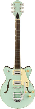 Gretsch electric guitar in light green with two pickups, f-shaped sound holes, cream pickguard, three control knobs, and a silver Bigsby tremolo arm.