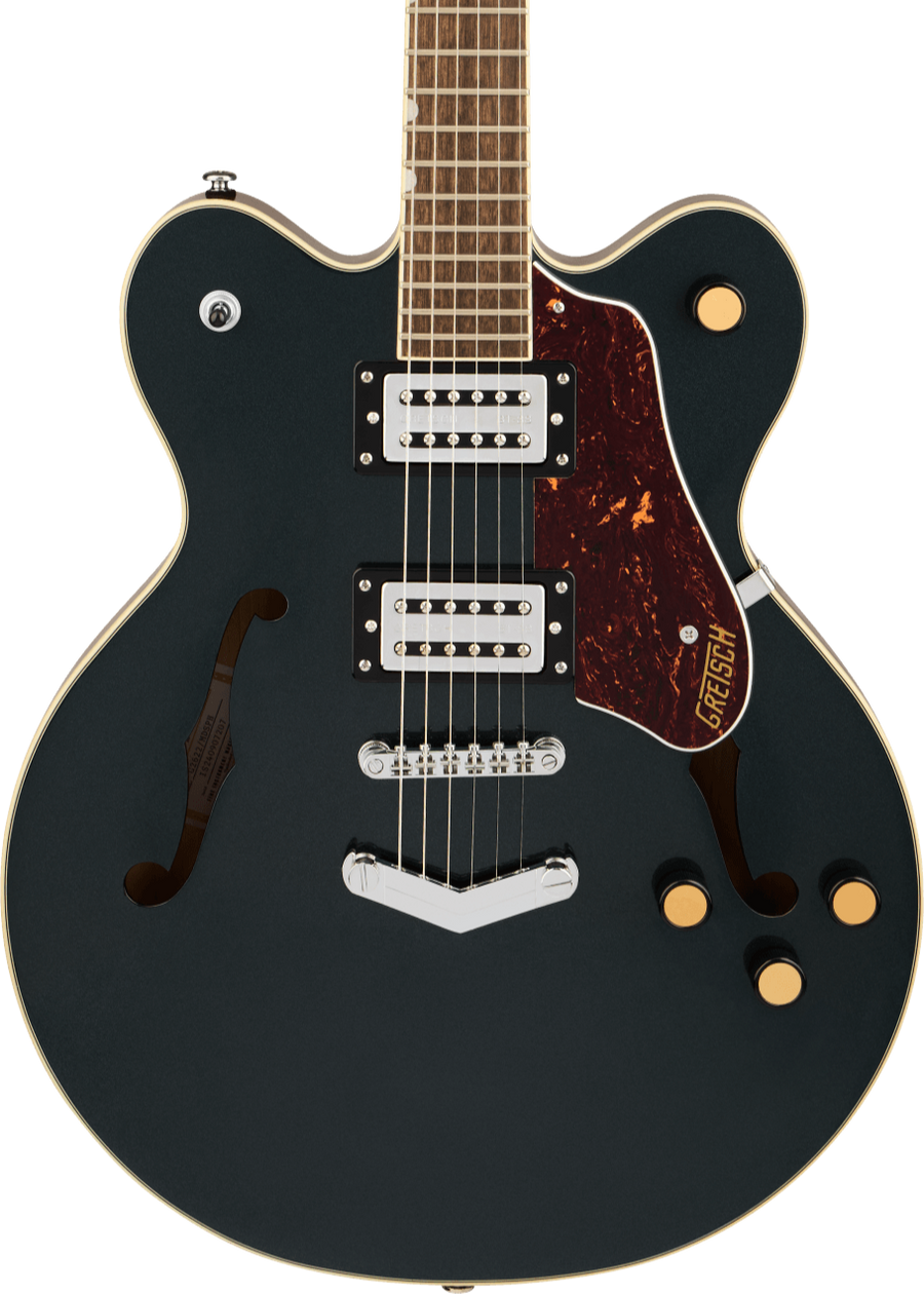 Black semi-hollow electric guitar with two humbucker pickups, gold knobs, tortoiseshell pickguard, and f-holes on each side.