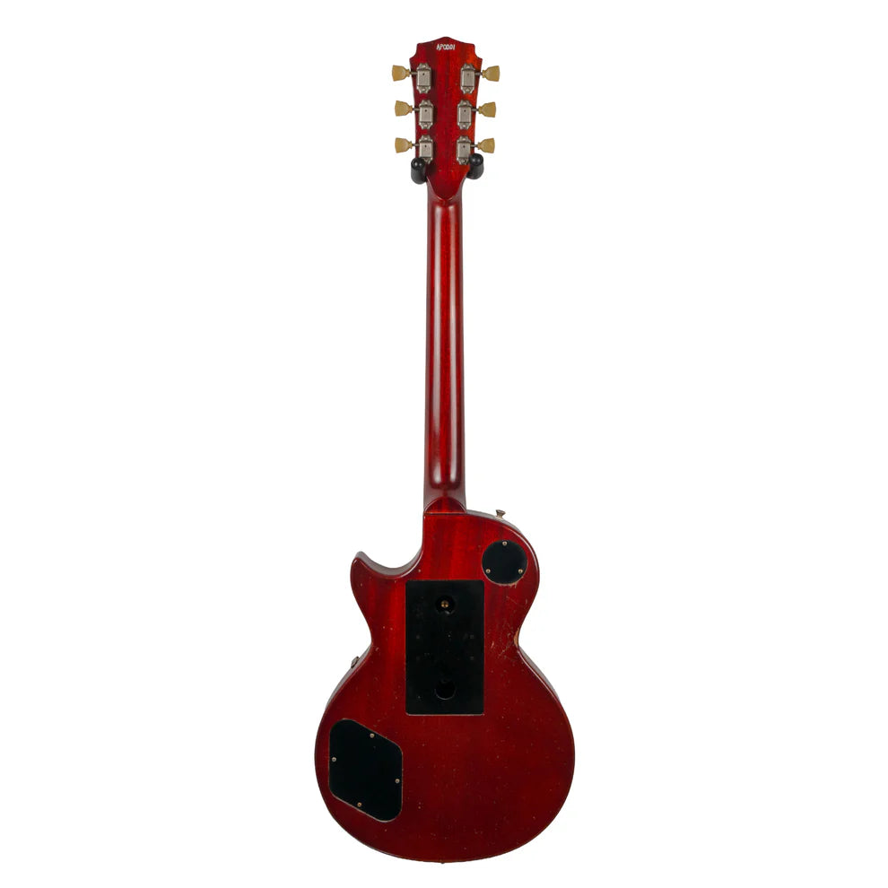 Red electric guitar shown from the back, with a single cutaway, gold tuning pegs, and three black plastic electronics covers on the body.
