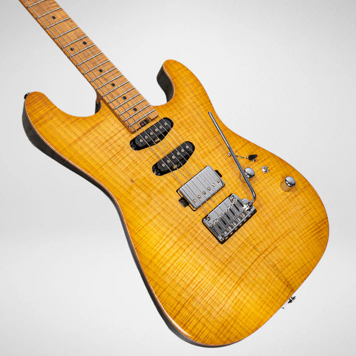 Yellow electric guitar with a flamed maple top, two single-coil pickups, one humbucker, a whammy bar, and chrome controls.