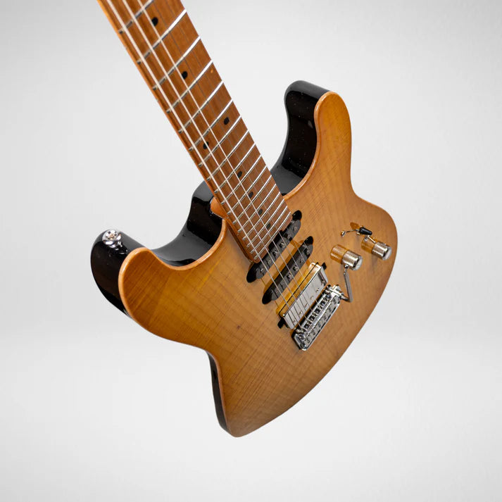 Electric guitar with a glossy wood finish, two humbucker pickups, a whammy bar, and metallic control knobs on a contoured double-cutaway body.
