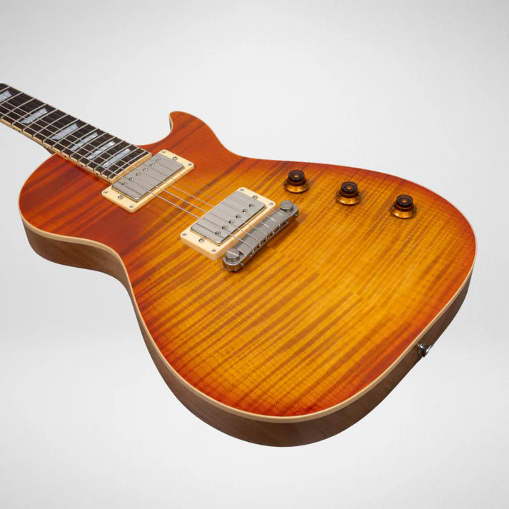 Electric guitar with a glossy, flamed maple top in sunburst orange, two humbucker pickups, four amber control knobs, and cream pickup frames.