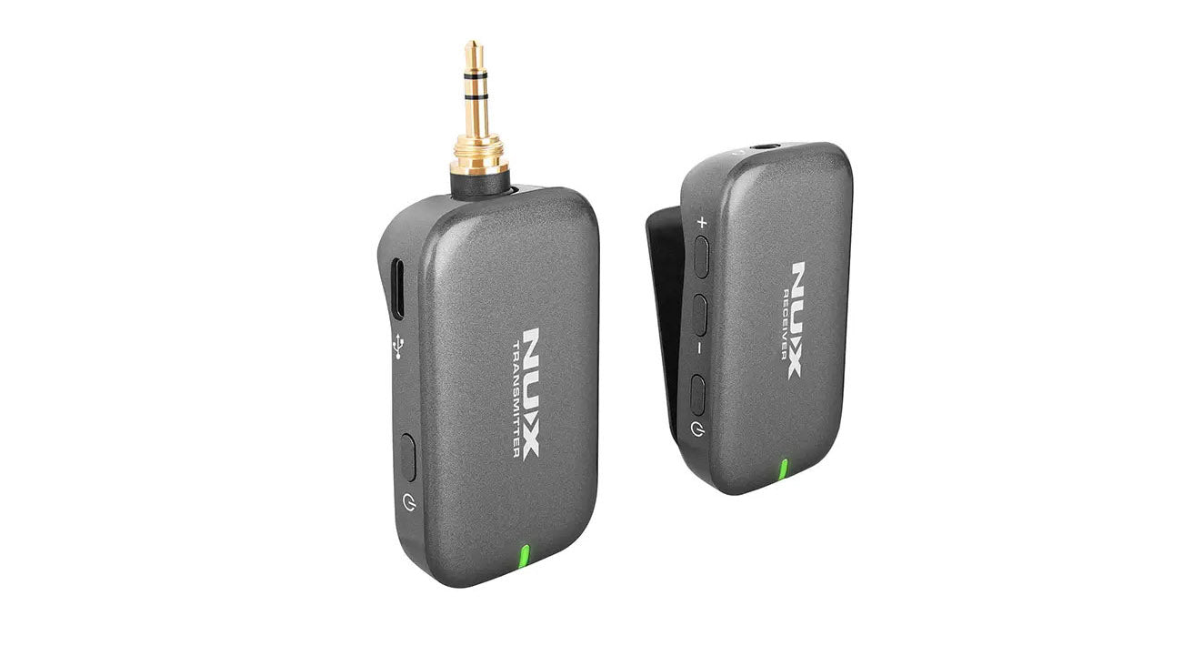 Two compact, rectangular NUX wireless FX pedal units labeled transmitter and receiver, each with side buttons and a small green LED indicator.