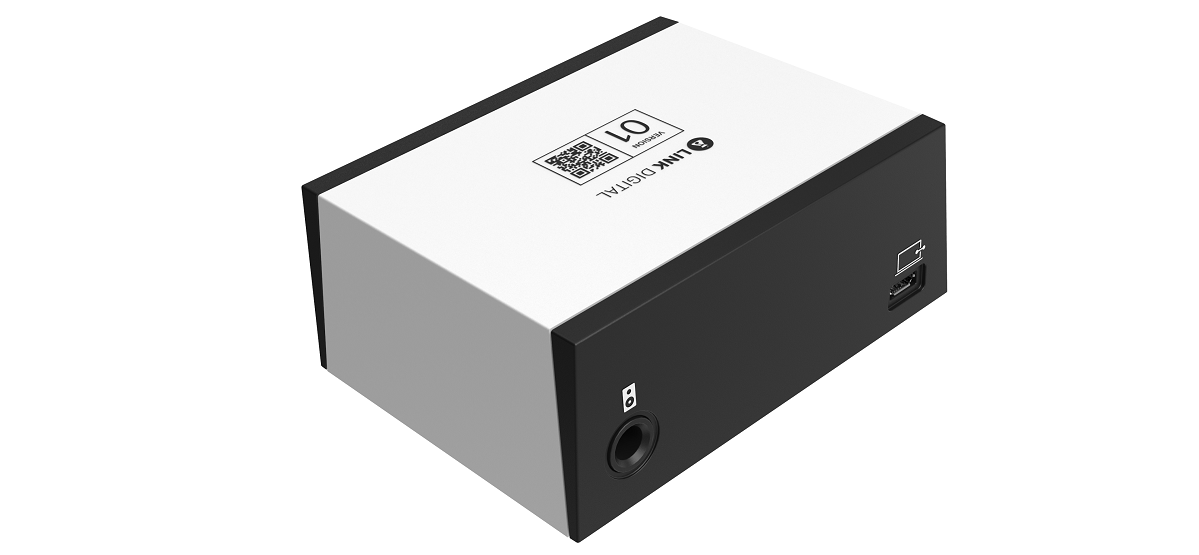 Rectangular audio interface with a white top, black sides, one audio jack, and a USB port. Top has a QR code and text "LINK DIGITAL 01."