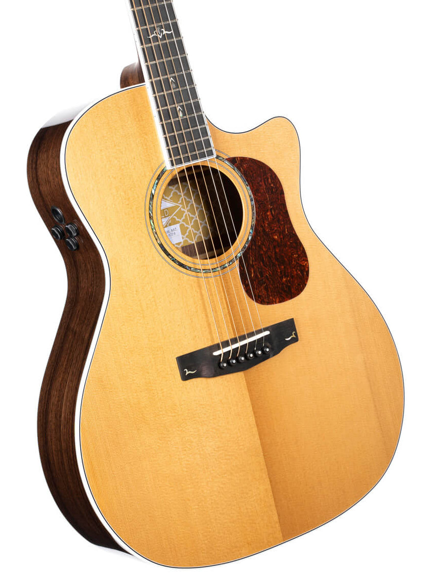 Acoustic guitar with a light wood top, dark wood sides, cutaway design, six strings, tortoiseshell pickguard, and black tuning controls on the side.