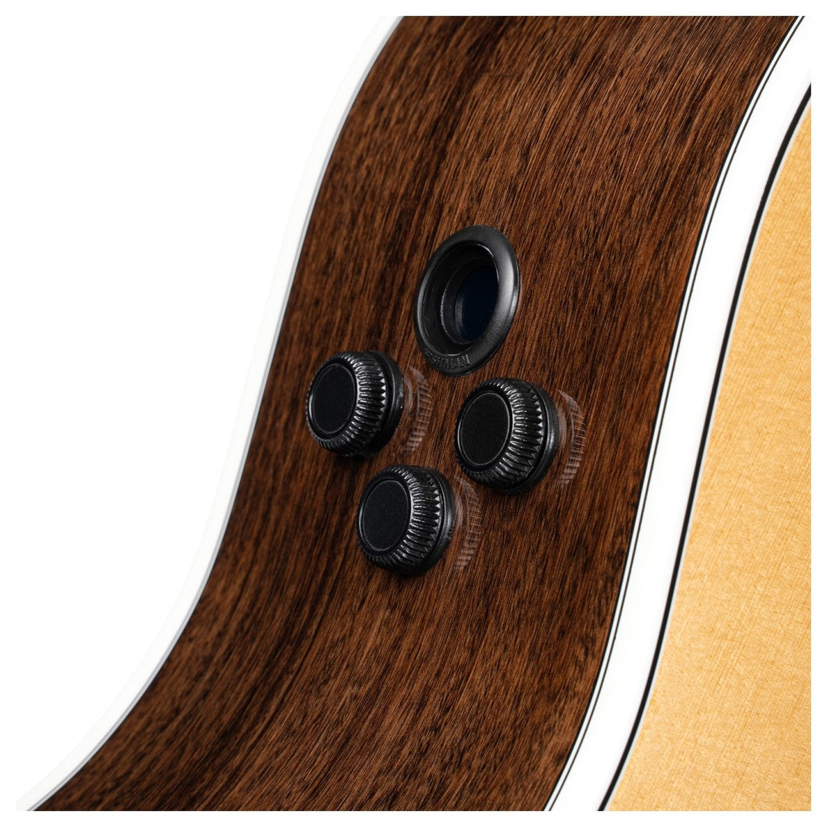 Close-up of an acoustic guitar’s side panel showing three black control knobs and a small input jack on a dark wood finish.