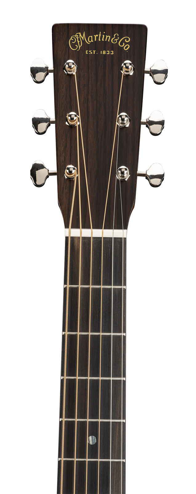 Headstock and upper neck of a Martin & Co. acoustic guitar with six tuning pegs and golden logo reading "Est. 1833" on dark wood.
