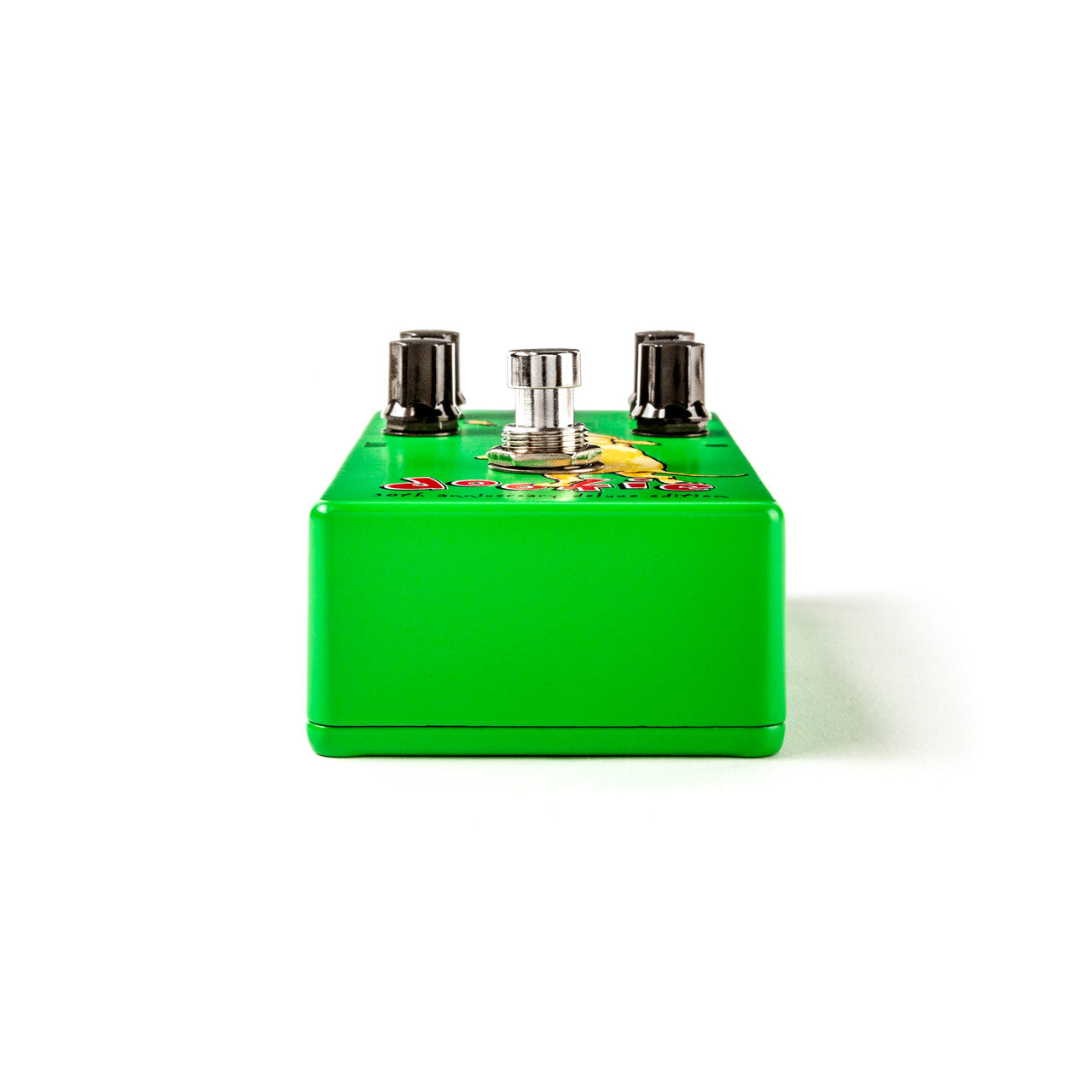 Bright green FX pedal with a silver footswitch and two black control knobs on top, viewed directly from the front against a white background.