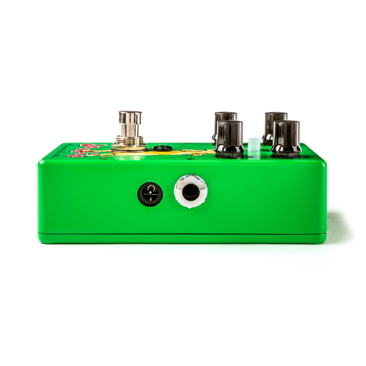 Bright green FX pedal with three black knobs, a footswitch, power input, and one quarter-inch audio jack on the side.