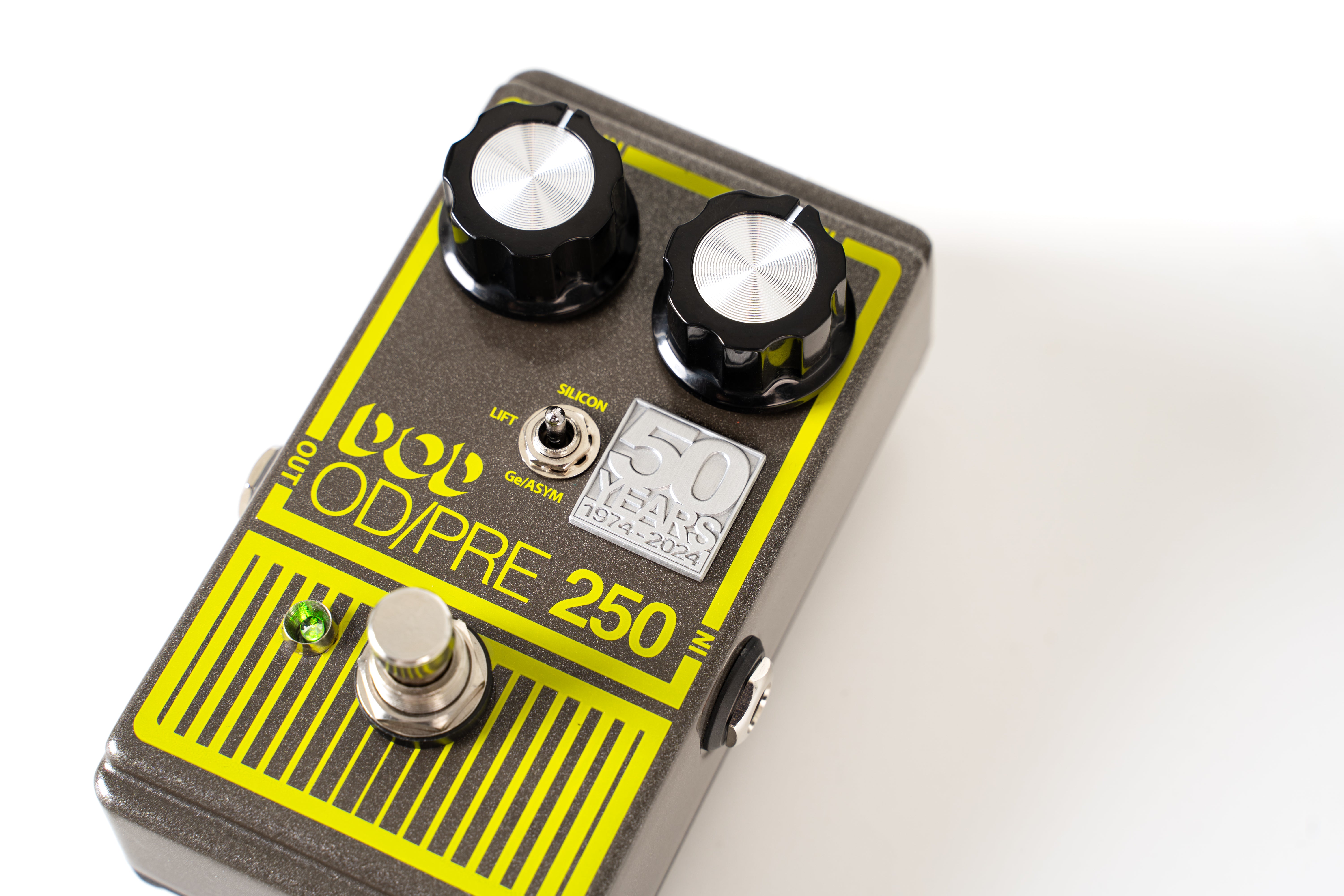 Silver FX pedal with two black knobs, toggle switch, footswitch, green LED, yellow OD/PRE 250 text, and a 50 Years 1974-2024 anniversary badge.
