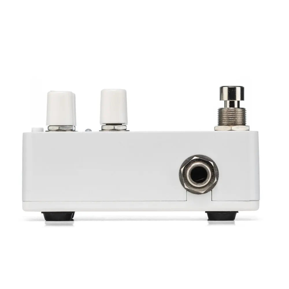 White FX pedal with two white control knobs, a metal footswitch, and a single quarter-inch input jack on the side facing the viewer.