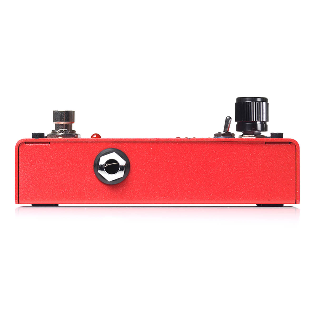 Red FX pedal with a single quarter-inch input jack on its side, a metal footswitch and two black control knobs on the top panel.