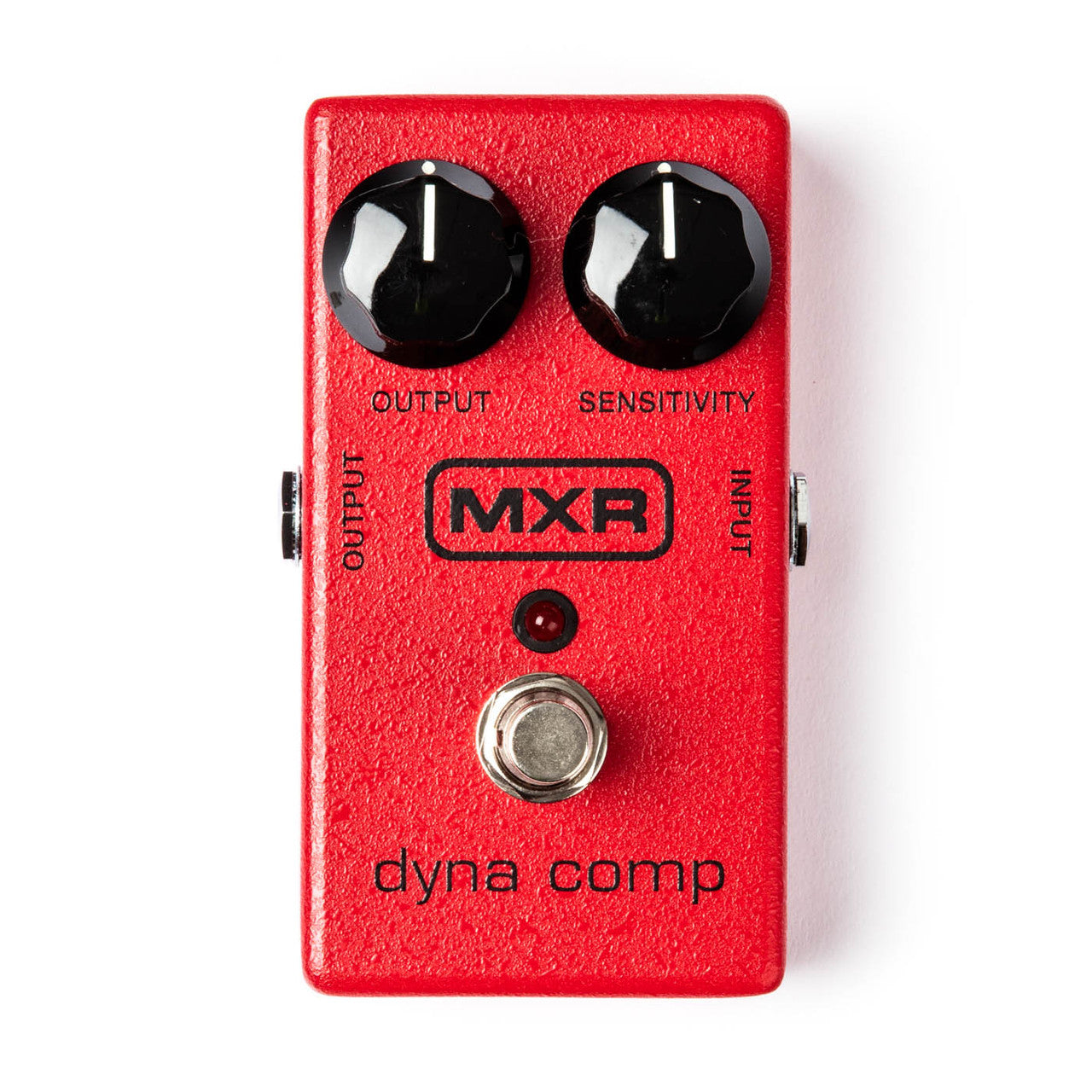 Bright red MXR Dyna Comp FX pedal with two black knobs labeled Output and Sensitivity, a silver footswitch, and a small red LED indicator.
