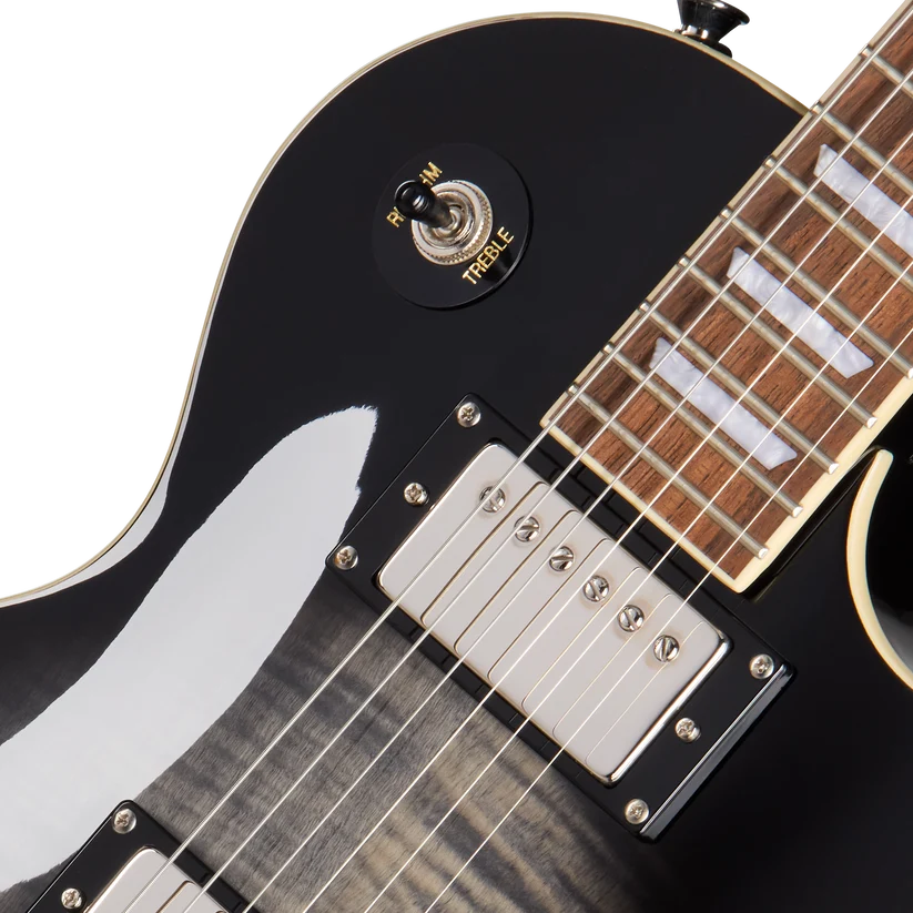 Close-up of an electric guitar showing two chrome humbucker pickups, a toggle switch labeled rhythm and treble, and part of the wooden fretboard.