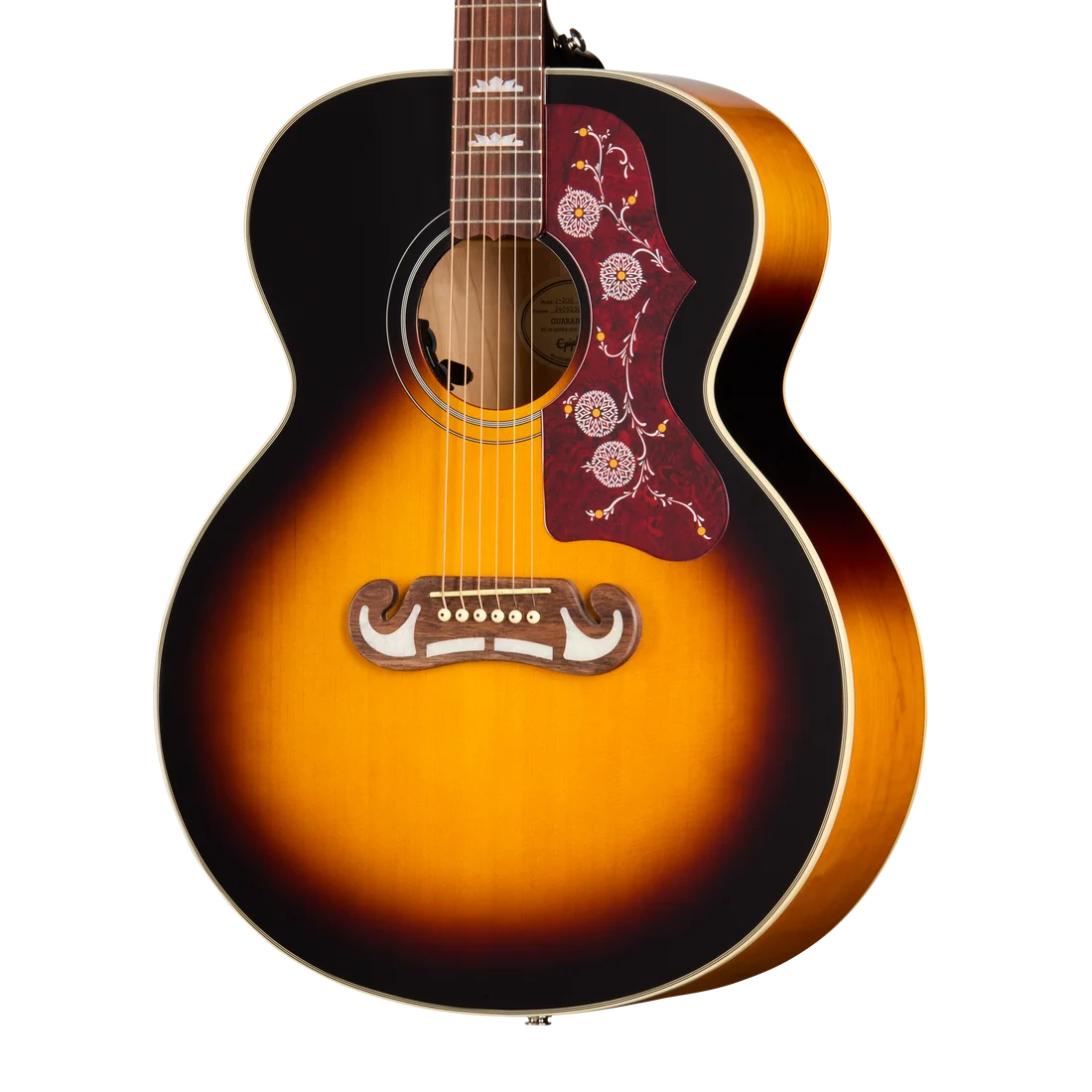 Sunburst acoustic guitar with a red floral pickguard and an ornate wooden bridge, featuring six strings and pearl inlays on the fretboard.