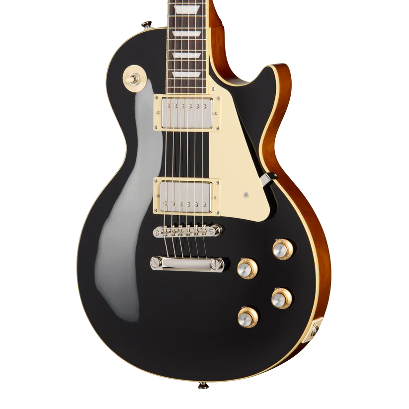 Black electric guitar with cream pickguard, chrome hardware, four gold control knobs, and a single-cutaway body featuring dual humbucker pickups.